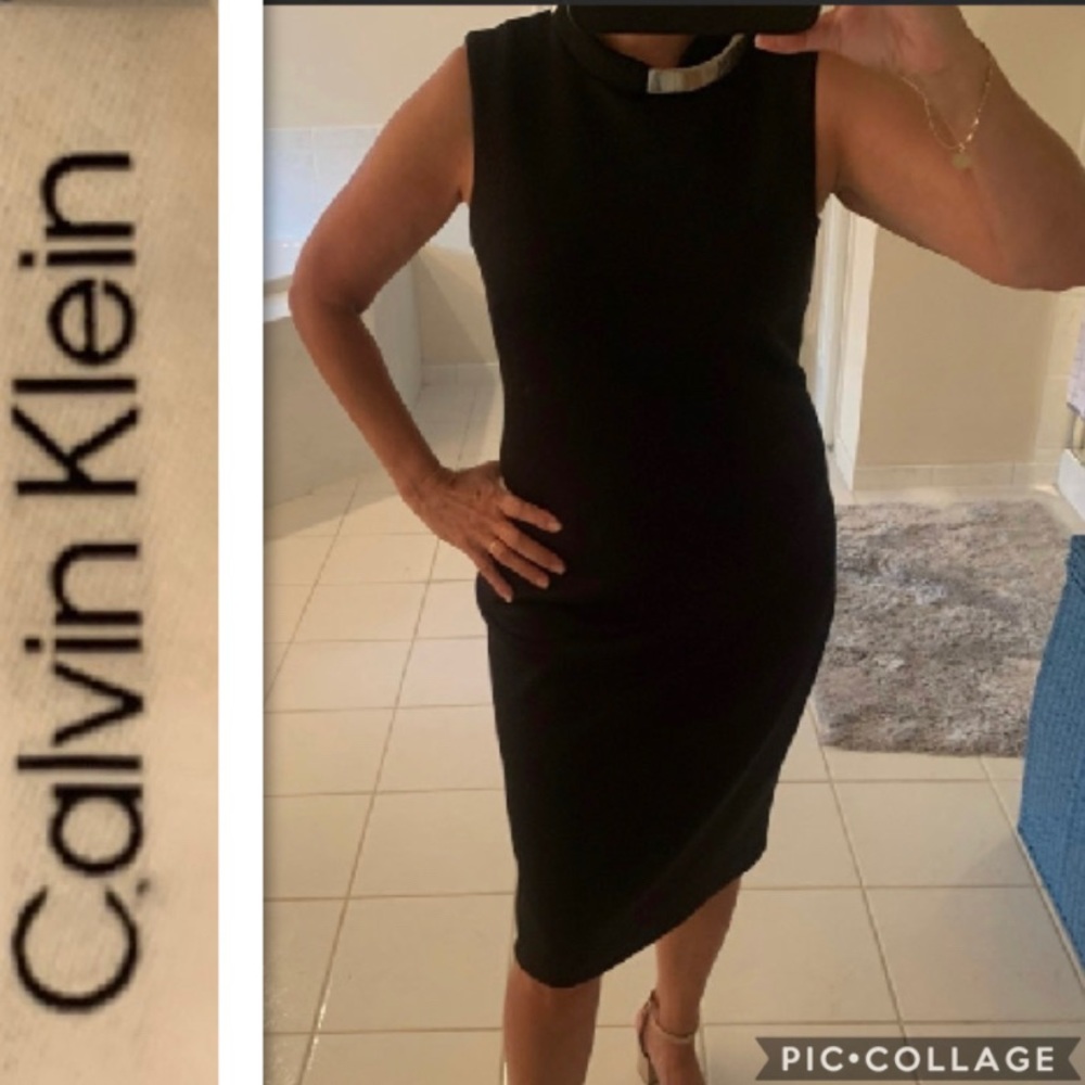 Dress. Black with silver collar detail.